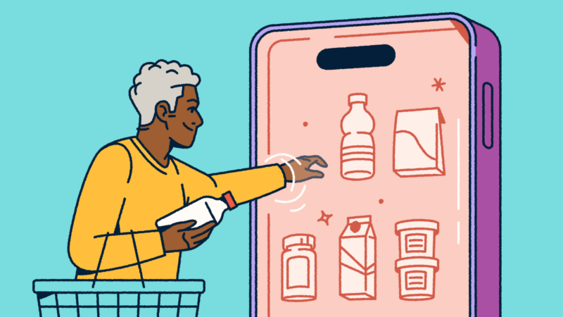 A person holding a shopping basket and selecting consumer packaged goods from a mobile "fridge."