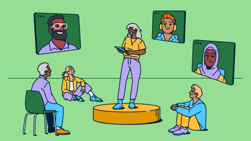 Illustration showing a hybrid meeting in action: a person presents from a circular stage while some attendees sit nearby in-person and others join remotely through video screens. The diverse group highlights how today's conferences blend virtual and in-person experiences to connect everyone regardless of location.