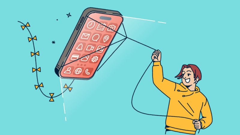 A person flying a mobile phone like a kite.