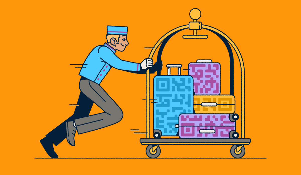 A bellhop pushing a luggage cart with several suitcases that have QR Code prints on them.
