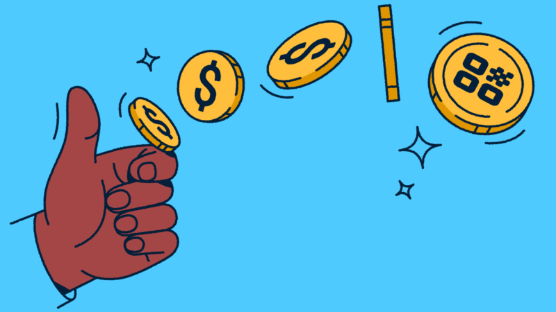 A hand flipping a coin with a QR Code on it.